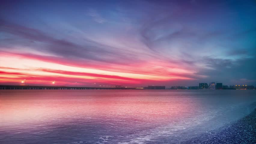 Beautiful sunset sky over the calm ocean water
