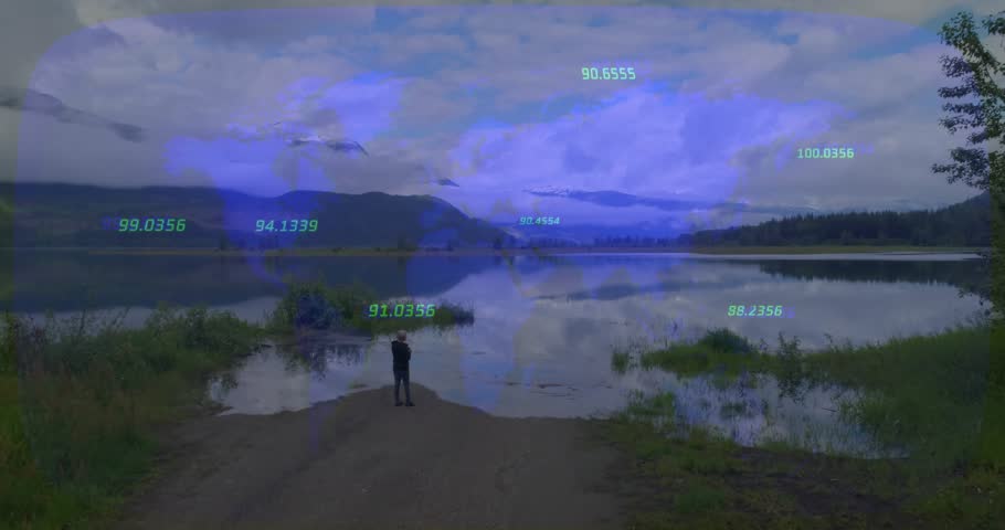 Woman standing shore raising device and activating AR arcs over sky and water, mapping lake data. Lakeside, overlay, calm, reflections, mountains, observer, trajectories