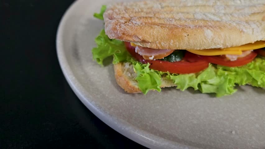 Ham and cheese sandwiches on plate