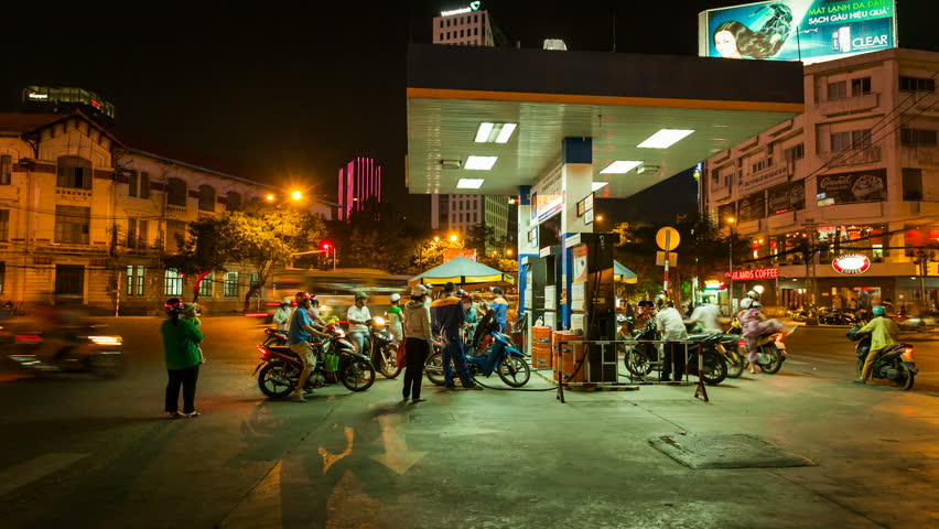 HO CHI MINH CITY - JUNE 8: Timelapse view of vietnamese moto taxi drivers taking