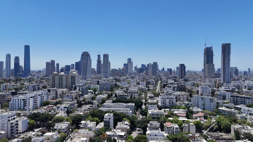 Aerial 4K view of North Tel Aviv residential neighborhoods and modern urban skyline, Israel