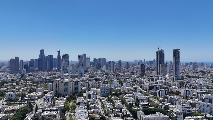 Aerial 4K view of North Tel Aviv residential neighborhoods and modern urban skyline, Israel