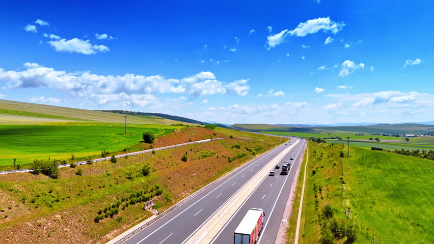 Traffic by the highways away from the big cities. Roads in the beautiful countryside of Slovakia. Aerial view.