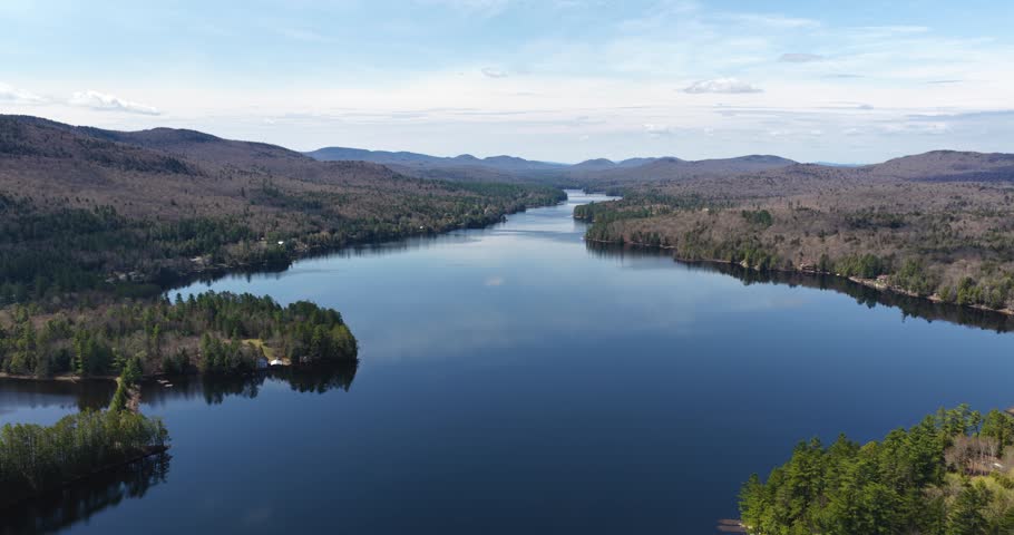 Long Lake, NY, USA  April 29, 2026  Aerial video of the scenic hamlet of Long Lake and Raquette River in the heart of New York