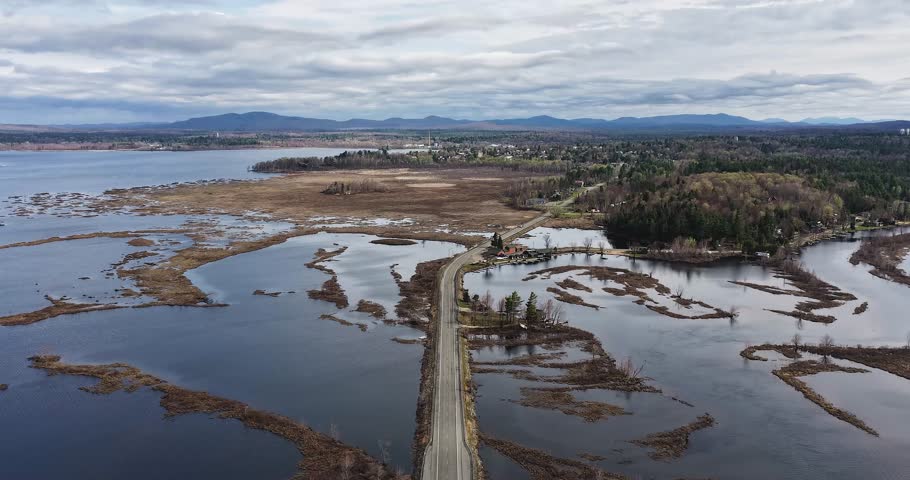 Tupper Lake, NY, USA - April 29, 2026  Aerial timelapse video of the Raquette river and surrounding wetlands of Tupper Lake in New York