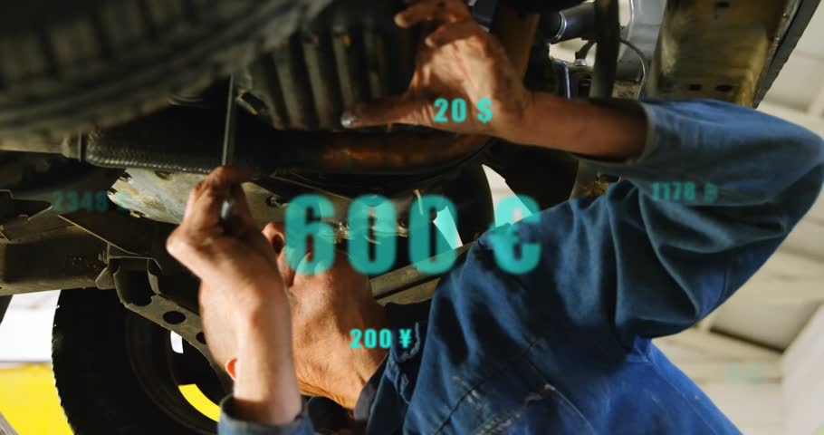Tech under car manipulating wrench on teal overlay appearing updating values on hands for auto fix. Mechanic, garage, undercarriage, bolts, torque, focus, blue