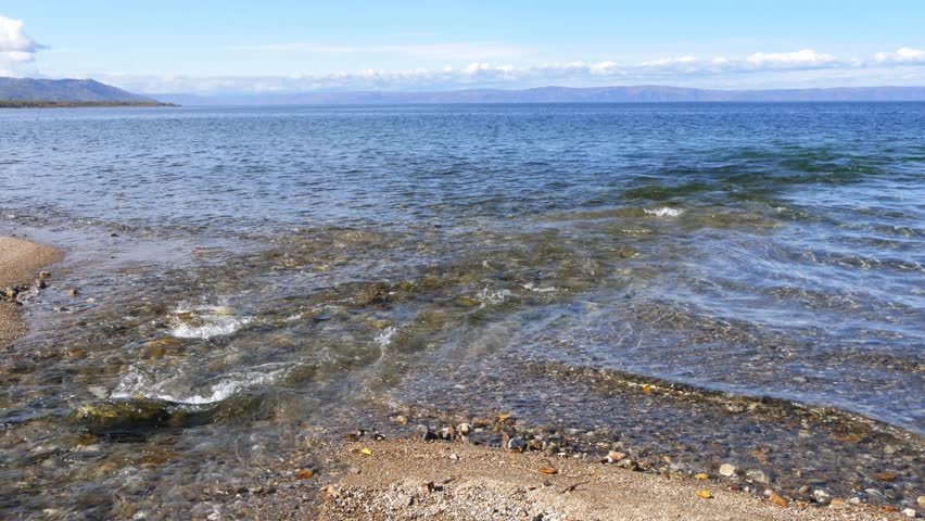 The mouth of a small stream that flows into Lake Baikal in Russian Siberia on a cold autumn evening.