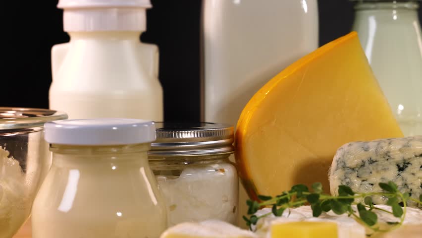 Variety of dairy food milk and cheese products on table.