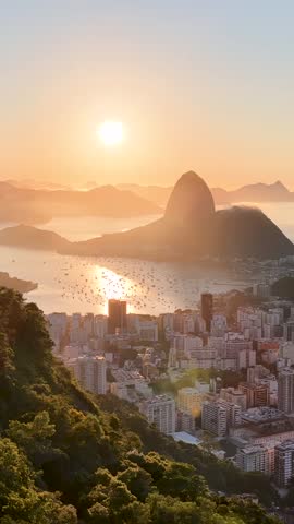 Rio De Janeiro Skyline At Sunset In Rio De Janeiro In Brazil. Sugarloaf Mountain. Corcovado Hill Landscape. Tourism Landmark. Rio De Janeiro Skyline In Brazil.