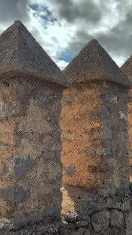 Historic stone wall in old town of Arta, Spain. Fortress structure, medieval architecture and cultural landmark in Mallorca.