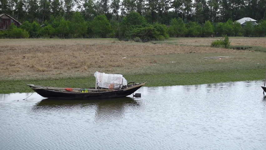 Some small wooden fishing boats seen on the way to Char Kukri Mukri union, Bhola District