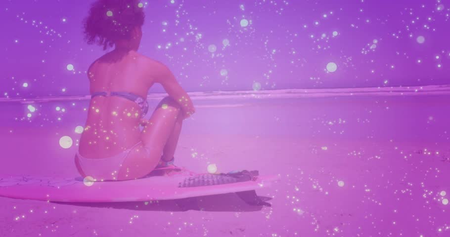 Woman sitting on board facing ocean, breeze starting posture shifting, pink haze veiling, branding. Surfboard, beach, horizon, seascape, contemplative, serene, bokeh