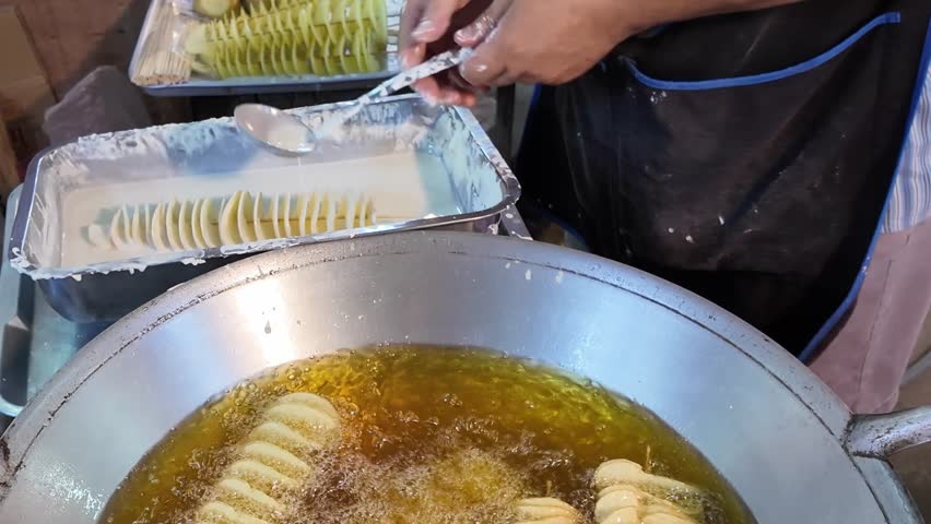 Coating Spiral Potatoes in Batter Street Food Preparation Thailand 4K