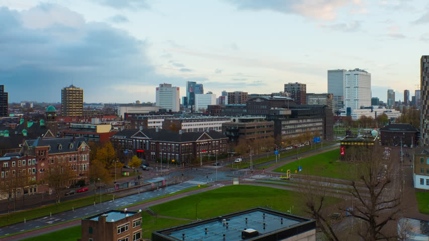 Rotterdam, Netherlands. Aerial view of the city Rotterdam, Netherlands during the evening with cloudy sky. Time-lapse with car, panning video