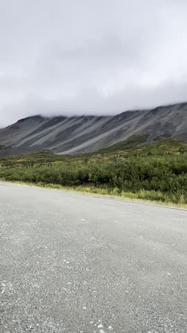 Fog over mountains on the Richardson Highway on a summer day in Alaska.