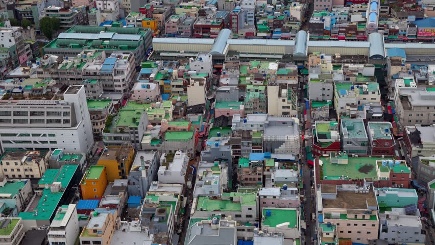 Busan South Korea cityscape displaying dense urban housing and rooftops from an aerial perspective