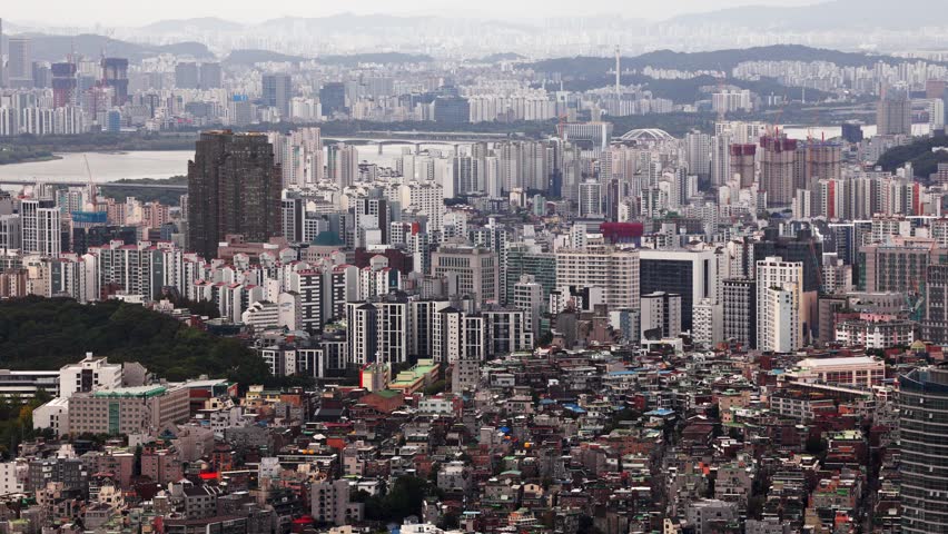 Seoul metropolitan area with numerous buildings, residential blocks, and the Han River visible