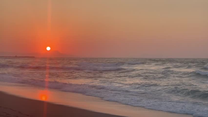 Beautiful sunset at beach in Greece