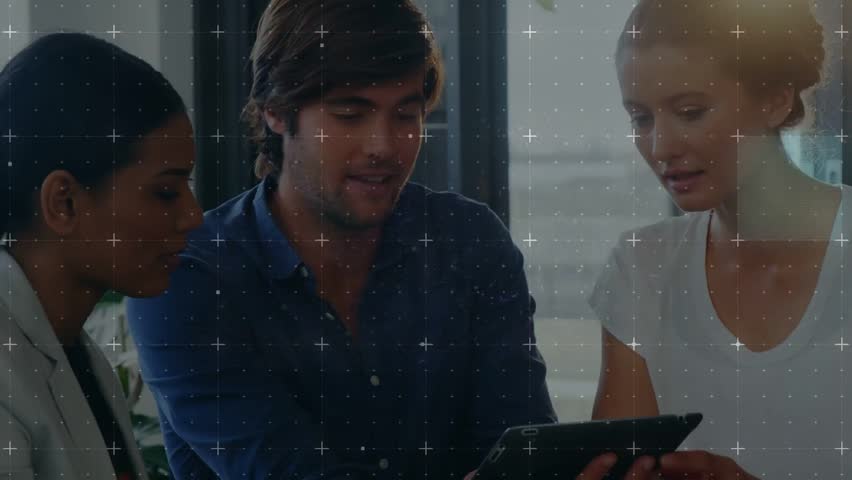 Man moving tablet and pointing women leaning in blue squares and crosshairs passing for tech review. Collaboration, teamwork, professionals, meeting, office, display, device