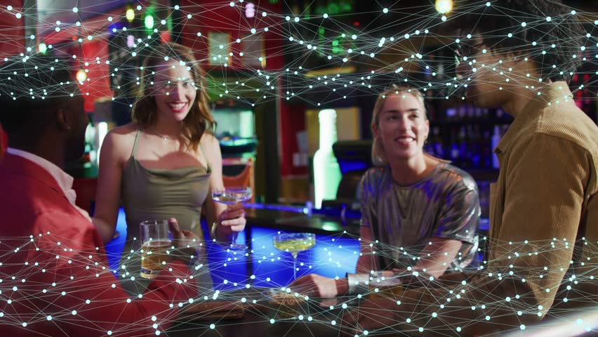 Four adults chatting at blue-lit bar, man raising pint sparking node overlay, celebrating nightlife. Social, friendship, neon, laughter, toasts, counter, arcade
