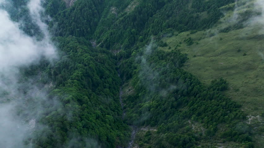 Aerial view misty foggy mountain landscape with clouds