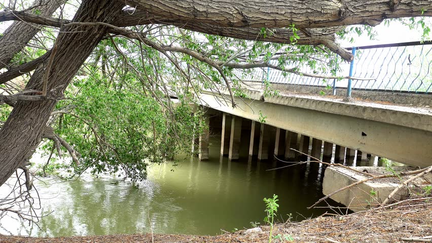Low angle side view of road bridge over canal