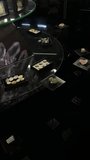A collection of polished semi-precious gemstones and iridescent abalone shell cabochons displayed in black organizers on a glass surface. The dark, high-contrast composition highlights the natural textures and shimmering colors of the minerals and jewelry components. - Powered by Shutterstock - Get 15% off with code: PIKWIZARD15