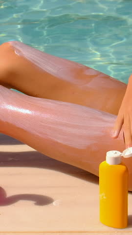 The child has sunscreen on his legs. Selective focus.
