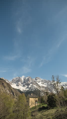 Sunset to sunrise holy grail time-lapse of dusk falling over the snow covered Cirque de Gavarnie and the nights sky with the Milky Way passing over before dawn breaks