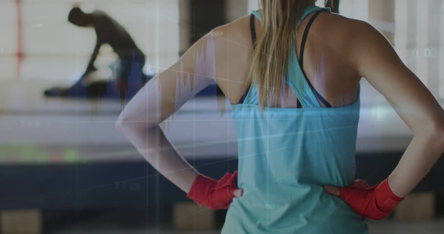 Turning woman in teal top, red wraps preparing workout as man finishing mat, overlay showing data. Training, partners, studio, gym, focus, posture, charts