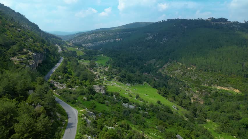 Scenic Landscape with Mountains and Valley Road