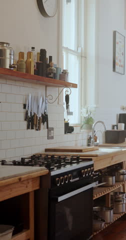 Kitchen, empty and stove with counter for cooking in restaurant for cuisine, meal prep and catering. Background, hospitality and room with utensils, appliances and equipment for culinary business