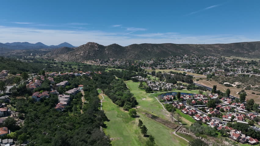 Aerial view of Ramona neighborhood with mountain, valley and San Vicente Golf Course, in California, USA