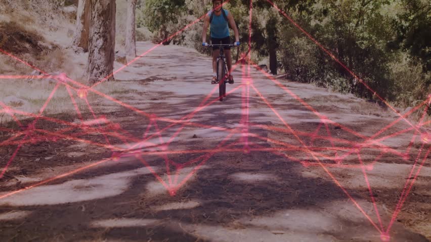 Cyclist entering and activating red mesh tech overlay while approaching camera slowing holding bike. Bicycle, trail, forest, motion, sunlight, futuristic, holographic