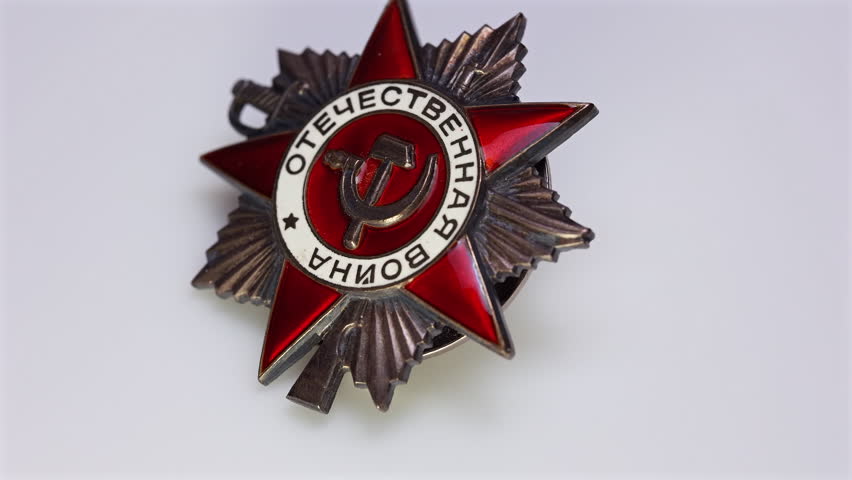 Zoom out from Soviet Order of Patriotic War military medal macro