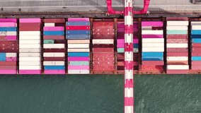 Aerial views reveal vibrant shipping containers neatly stacked at port terminals, highlighting the bustling logistics of maritime transport and global trade. - Powered by Shutterstock - Get 15% off with code: PIKWIZARD15