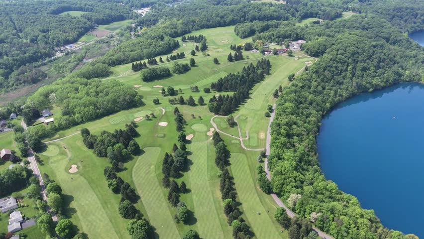 A beautiful landscape embellished by the waters of a state preserved lake and the configuration of fairways and greens designating their own position on the ground below.