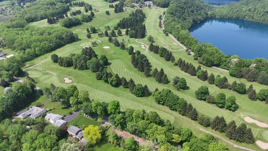 A beautiful landscape embellished by the waters of a state preserved lake and the configuration of fairways and greens designating their own position on the ground below.