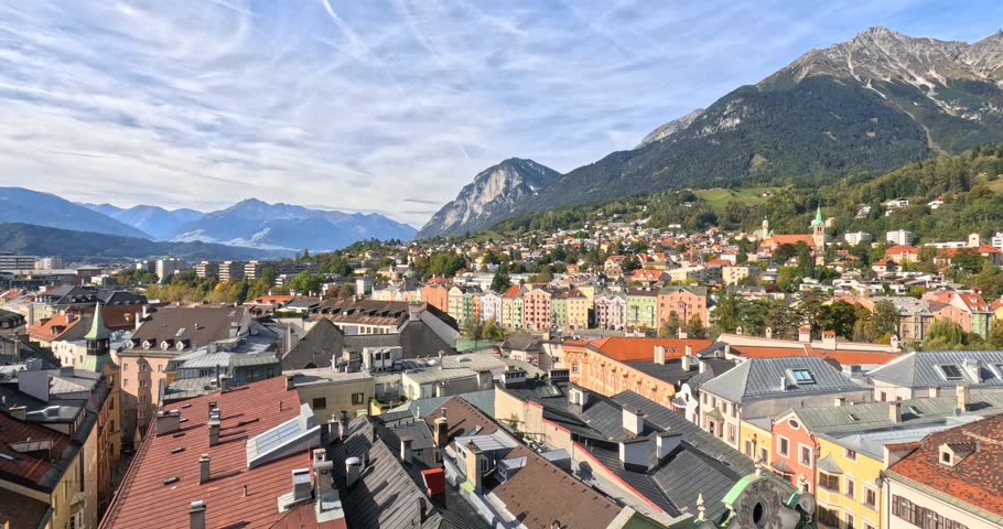 Beautiful panoramic view of Innsbruck, Austria, with its colorful old town and the Alps mountains.