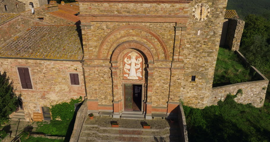 Old Medieval Church Of Santa Maria Assunta In The Village Of Panzano In Chianti, Tuscany, Italy. Aerial Rotate Shot