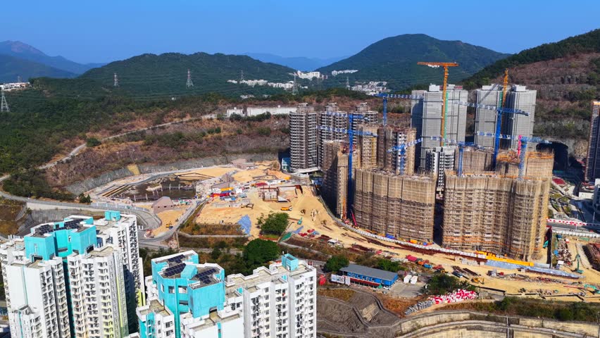 Anderson road Kwun tong Hong kong aerial drone view of former stone quarry transforming into public housing estates and pedestrian links to Sau mau ping