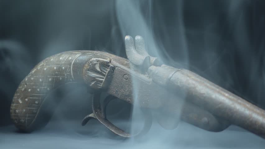 Old Weapon on Black Background Surrounded by White Smoke