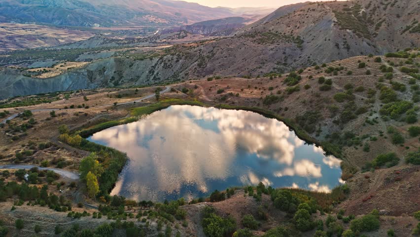 Calm lake nestled in rugged hills