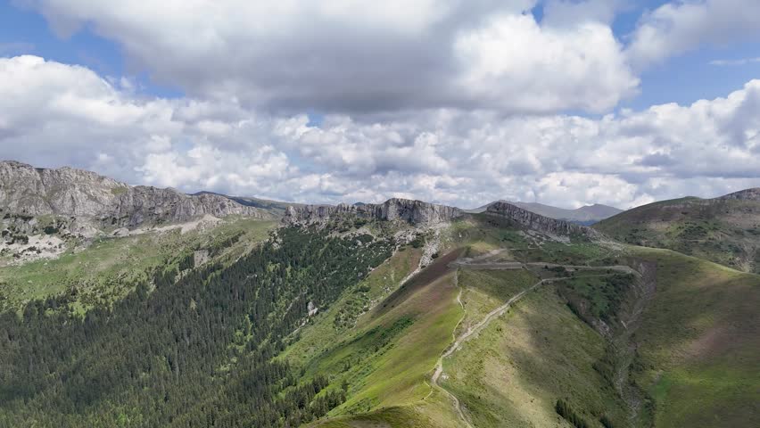 Aerial View of Bucegi Mountains Rocky Ridge with Alpine Meadow Trail