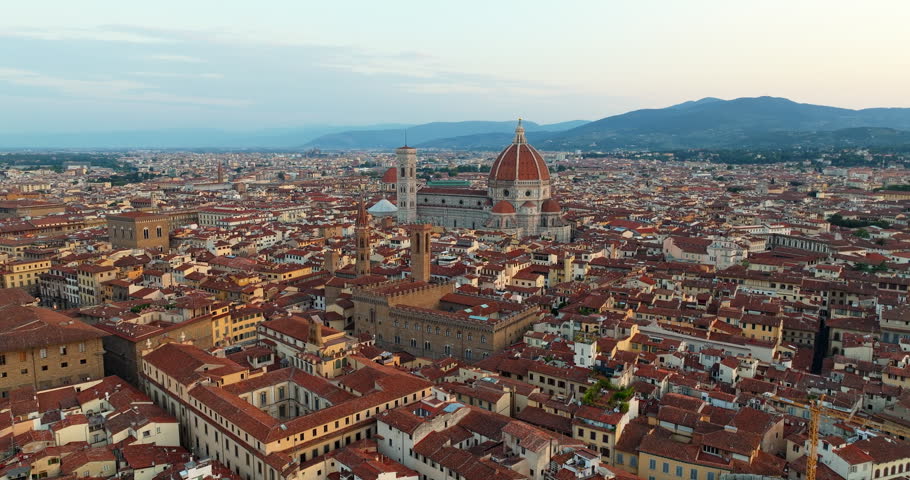 Aerial panorama Florence Italy Duomo Cathedral skyline sunset. Iconic renaissance architecture Santa Maria del Fiore dome city view. Summer travel tourism destination drone photography exploration landscape