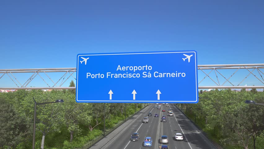 Blue motorway sign for Porto Francisco Sa Carneiro Airport with an airliner flying above along the road toward the airport