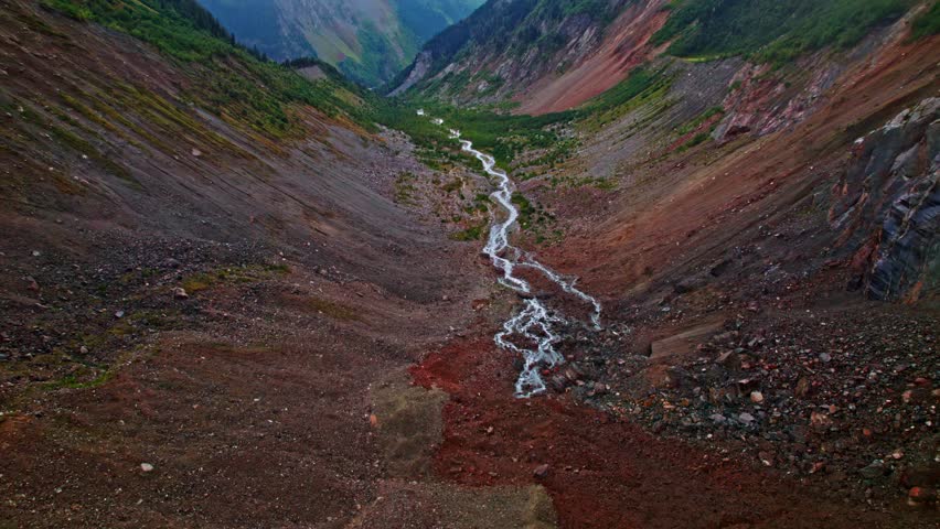 Aerial Flight Over Rocky Mountain River Valley in Svaneti, Georgia