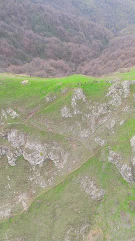 Mountain Ridge Landscape with Hikers and Valley View