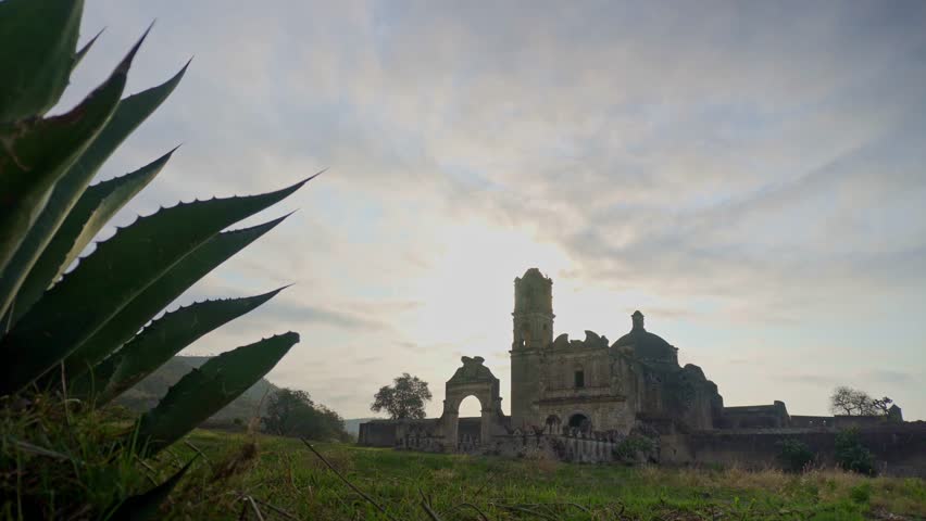 Old ruins of the ex hacienda de Caxcantla in puebla, mexico, with a blue agave plant