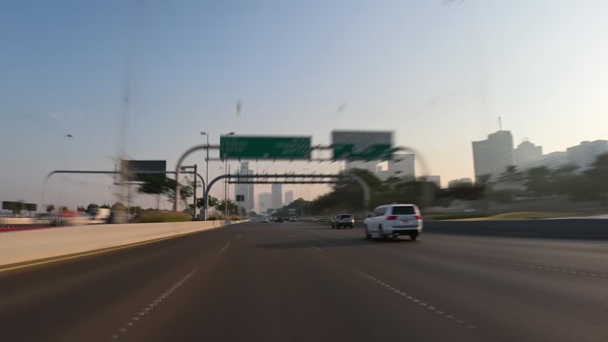Fast car ride through Abu Dhabi city streets, United Arab Emirates